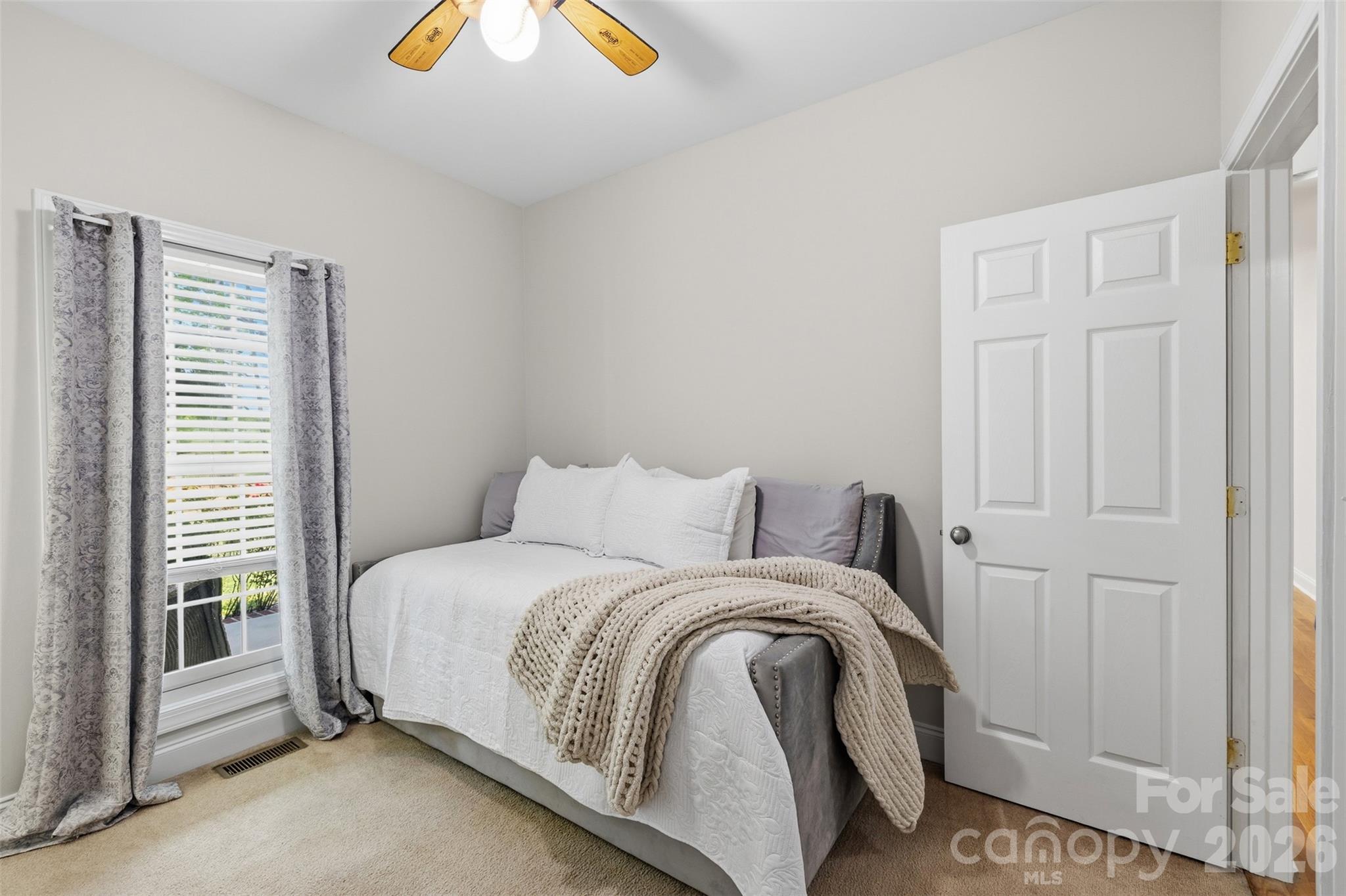 710 Sleepy Hollow Road Midland, NC 28107 - Photo 11 of 29 a bedroom with a bed and a painting on the wall