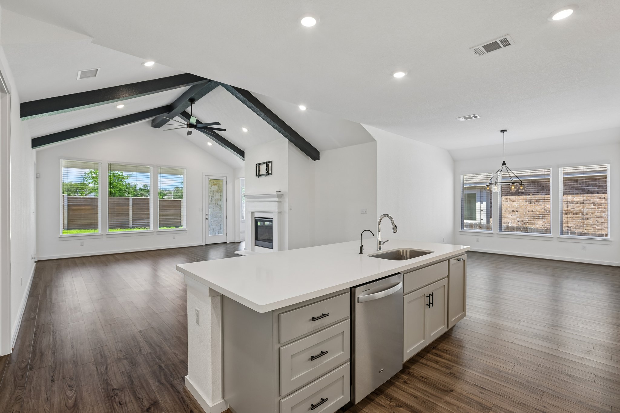 317 Independence Drive Kyle, TX 78640 - Photo 11 of 40 a kitchen with a sink and wooden floor