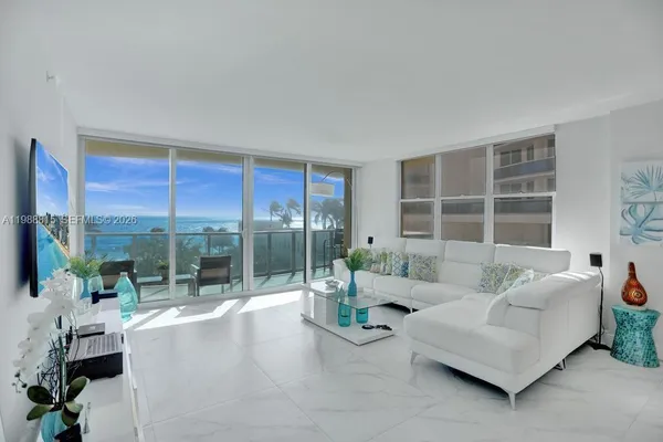a living room with furniture and a large window