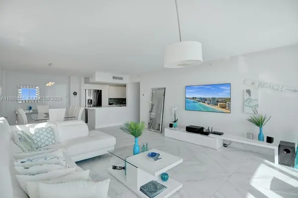 a living room with furniture and a table