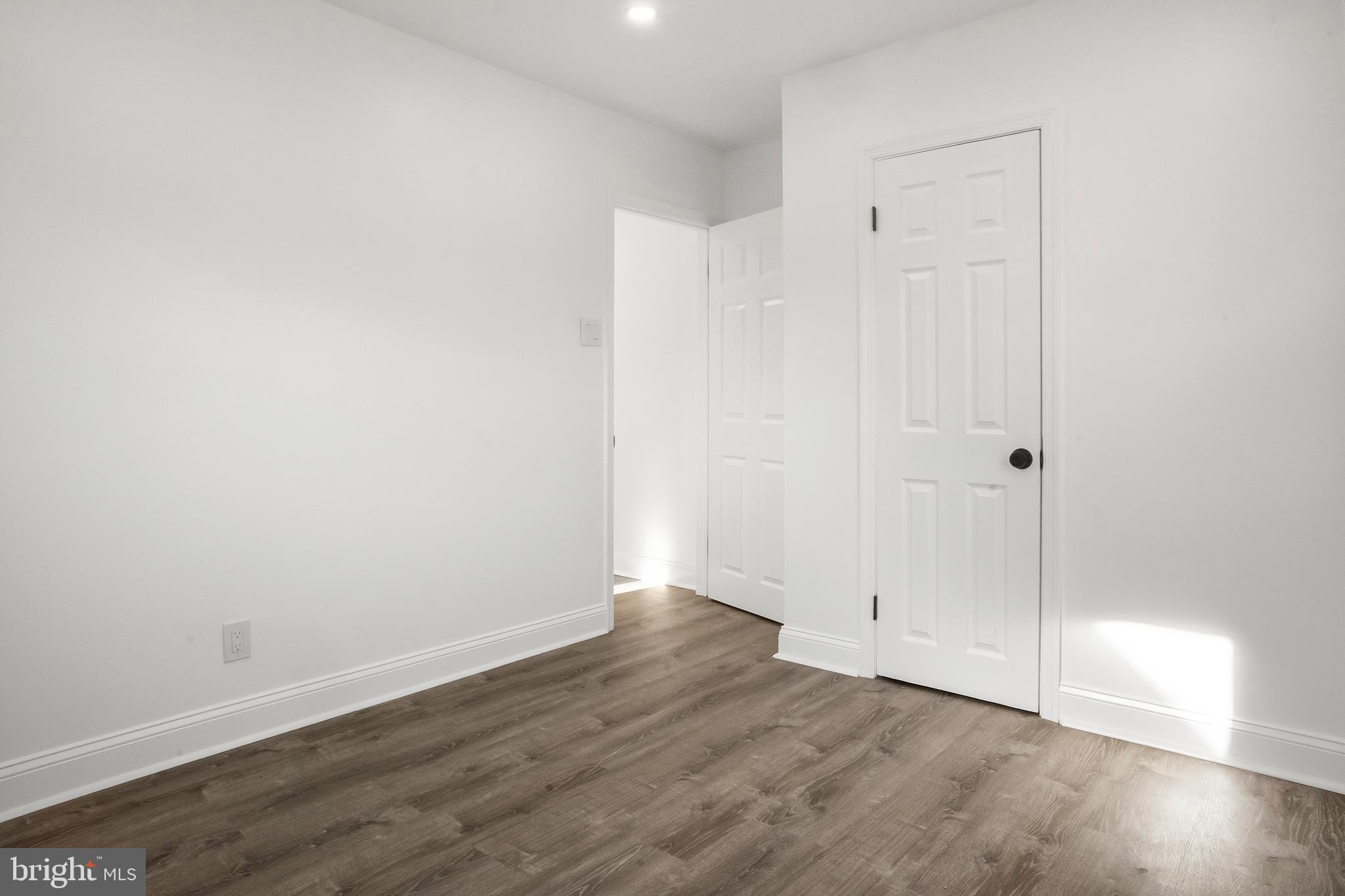 601 Evesham Avenue West Magnolia, NJ 08049 - Photo 11 of 20 a view of an empty room with wooden floor