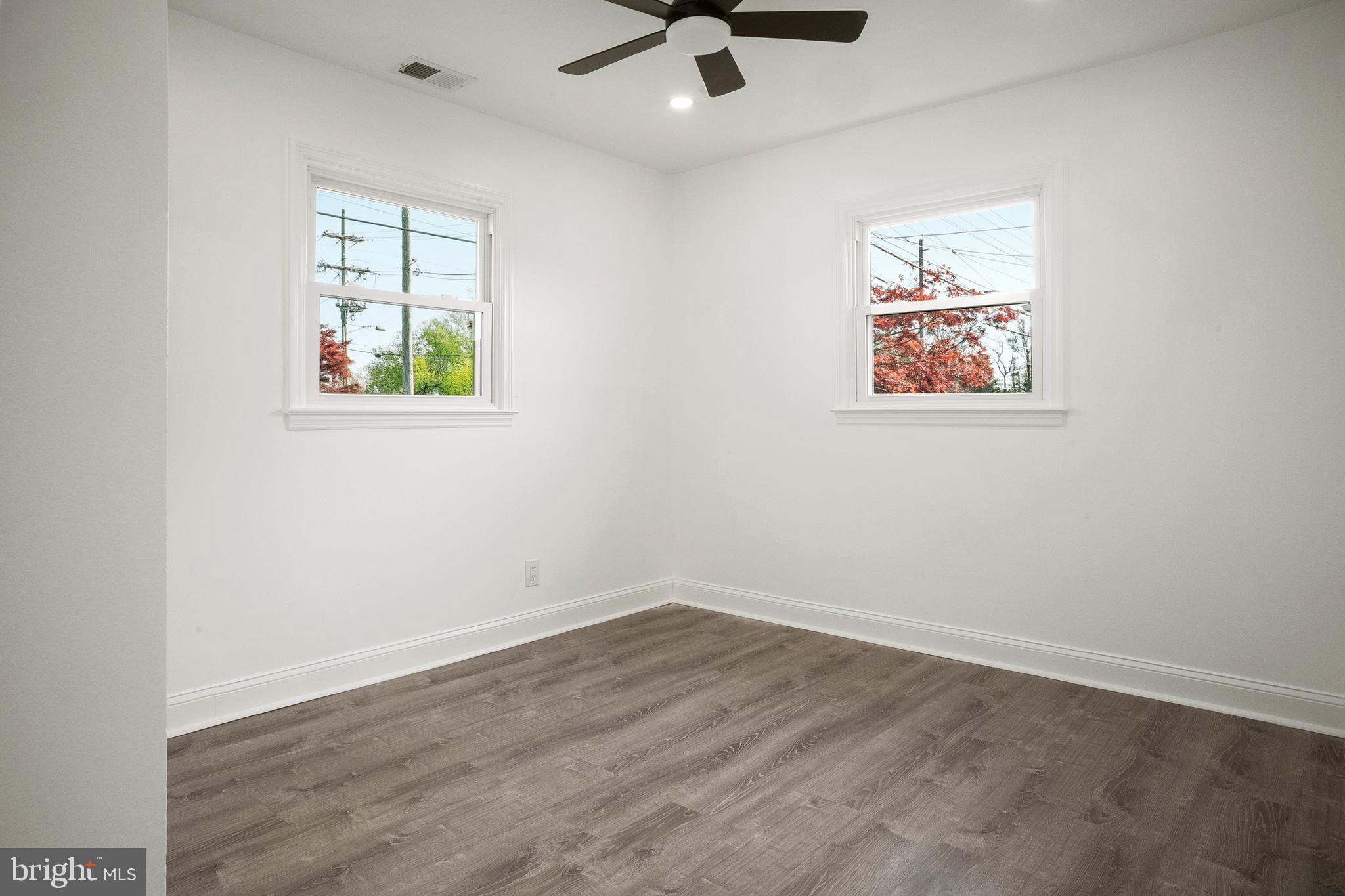 601 Evesham Avenue West Magnolia, NJ 08049 - Photo 12 of 20 an empty room with windows and ceiling fan