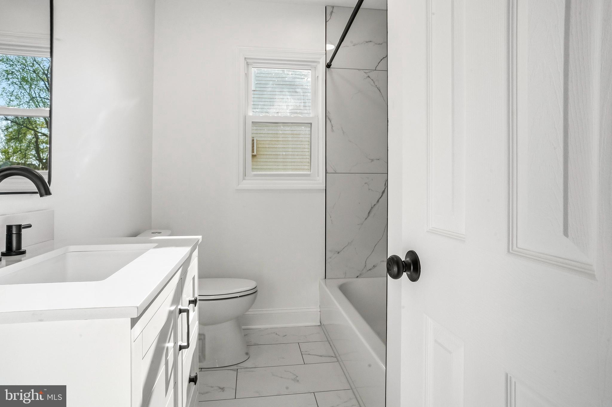 601 Evesham Avenue West Magnolia, NJ 08049 - Photo 13 of 20 a bathroom with a sink toilet and shower