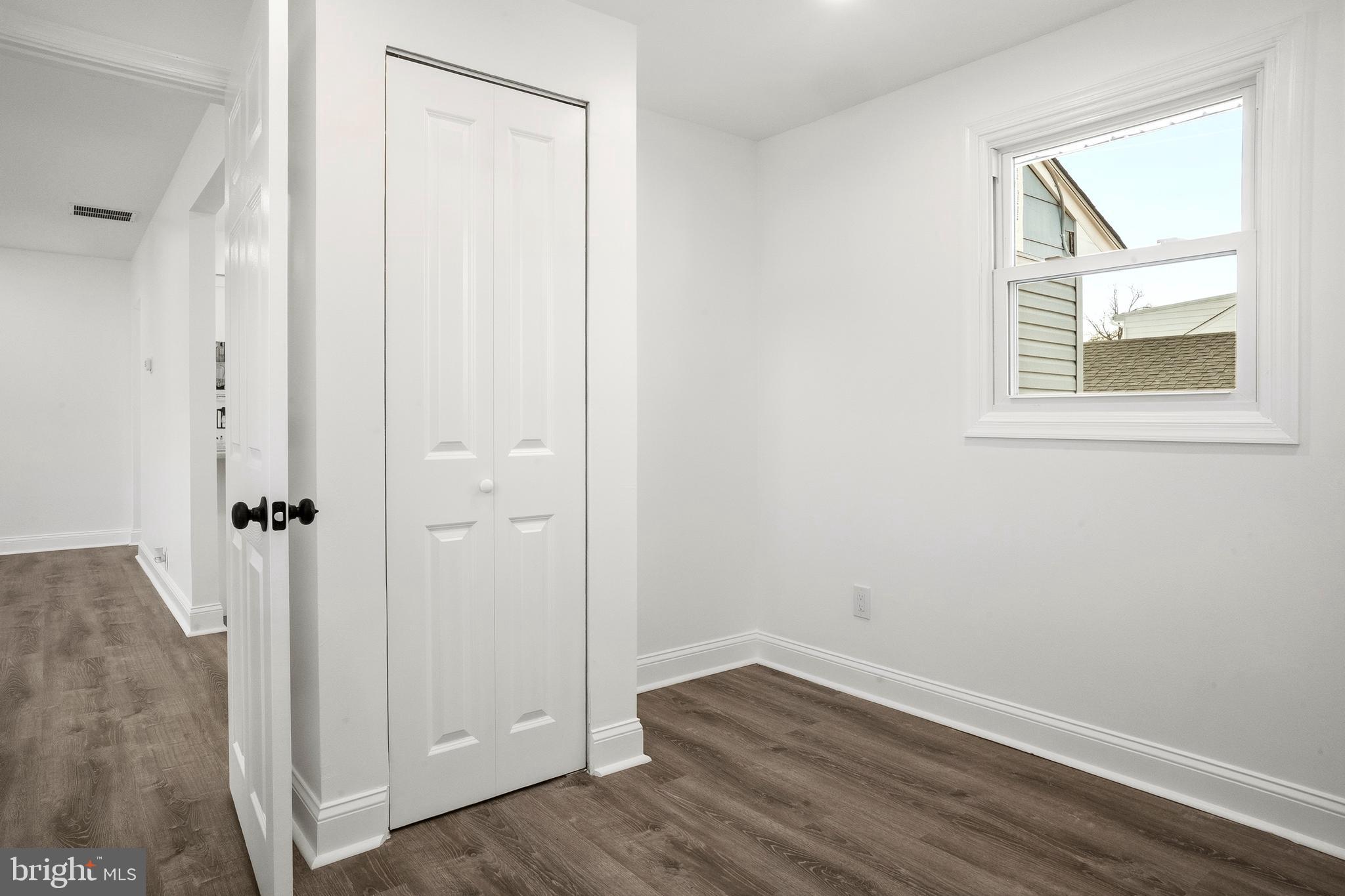 601 Evesham Avenue West Magnolia, NJ 08049 - Photo 18 of 20 an empty room with wooden floor and window