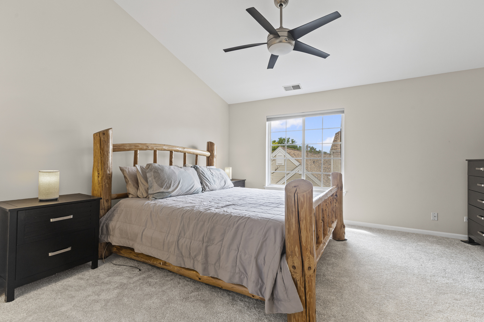 1719 Sienna Court Wheeling, IL 60090 - Photo 11 of 18 a bedroom with a bed and a chandelier