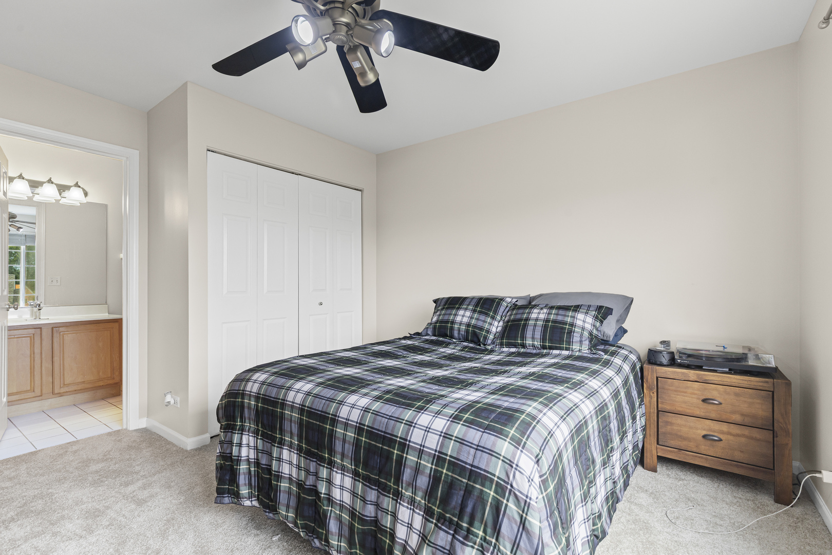 1719 Sienna Court Wheeling, IL 60090 - Photo 15 of 18 a bedroom with a bed and a cabinets