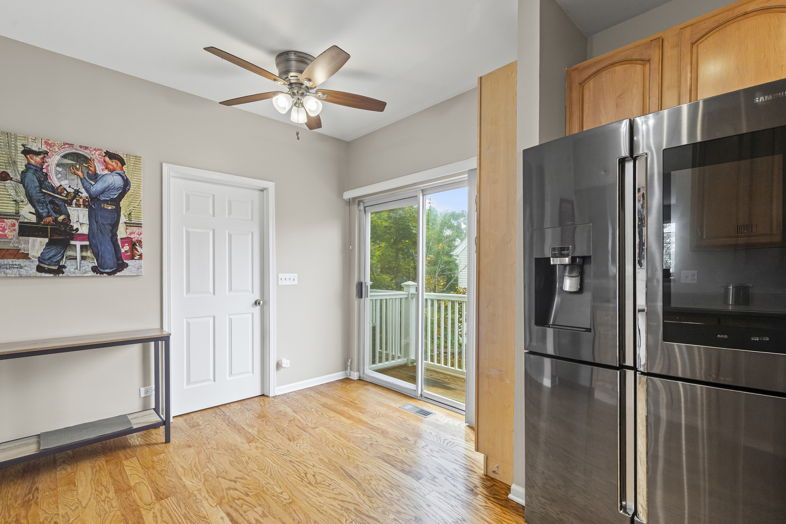 1719 Sienna Court Wheeling, IL 60090 - Photo 8 of 18 a kitchen with stainless steel appliances a refrigerator and a ceiling fan