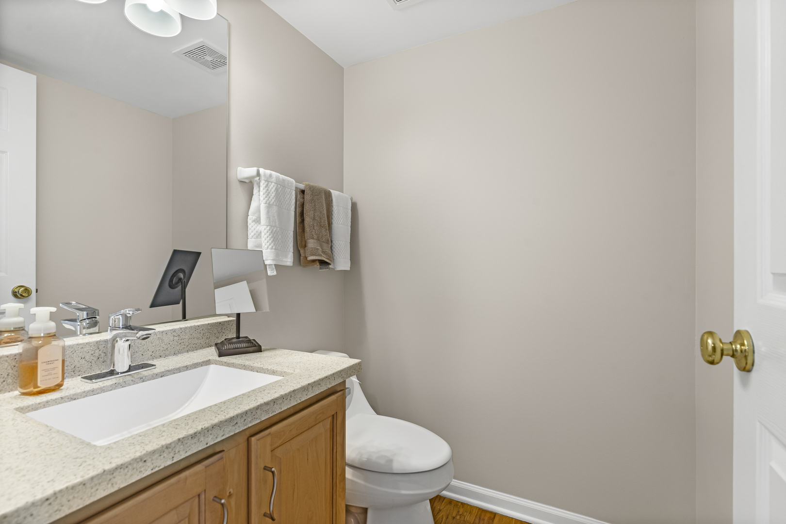 1719 Sienna Court Wheeling, IL 60090 - Photo 9 of 18 a bathroom with a granite countertop sink mirror vanity and toilet