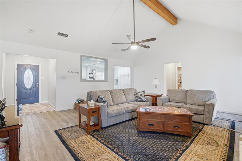 685 Cardinal Ridge Road Burleson, TX 76028 - Photo 17 of 40 a living room with furniture and a chandelier