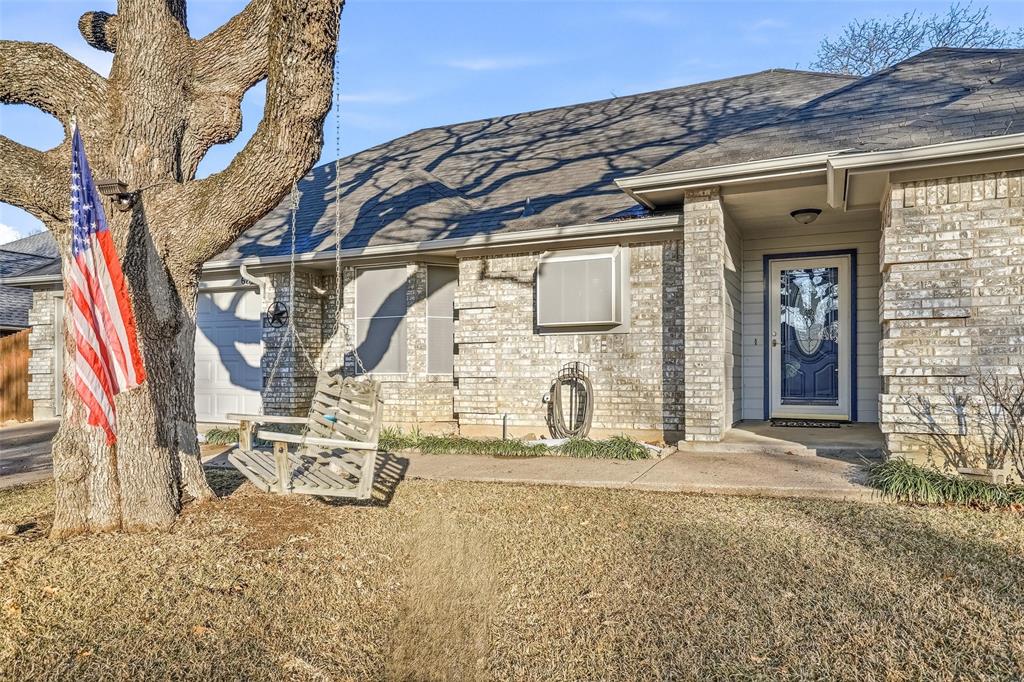 685 Cardinal Ridge Road Burleson, TX 76028 - Photo 2 of 40 a front view of a house with a yard