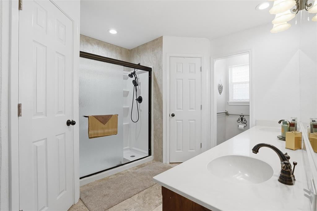685 Cardinal Ridge Road Burleson, TX 76028 - Photo 21 of 40 a bathroom with a sink and shower