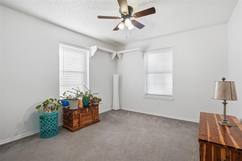685 Cardinal Ridge Road Burleson, TX 76028 - Photo 28 of 40 a living room with furniture and a window