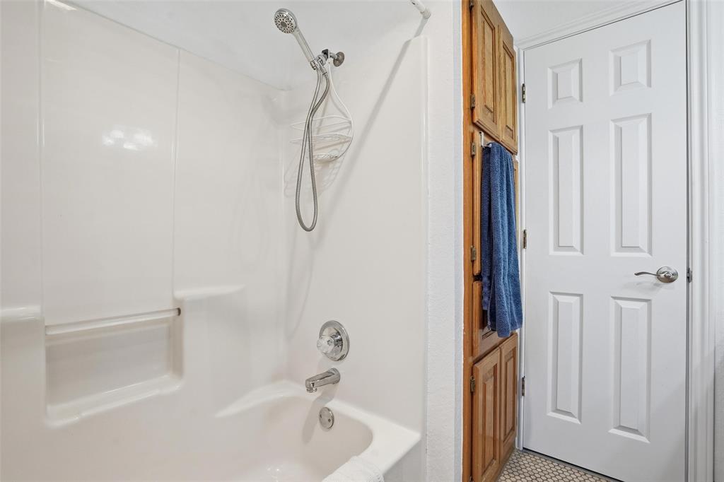 685 Cardinal Ridge Road Burleson, TX 76028 - Photo 32 of 40 a bathroom with a bathtub a shower and a sink