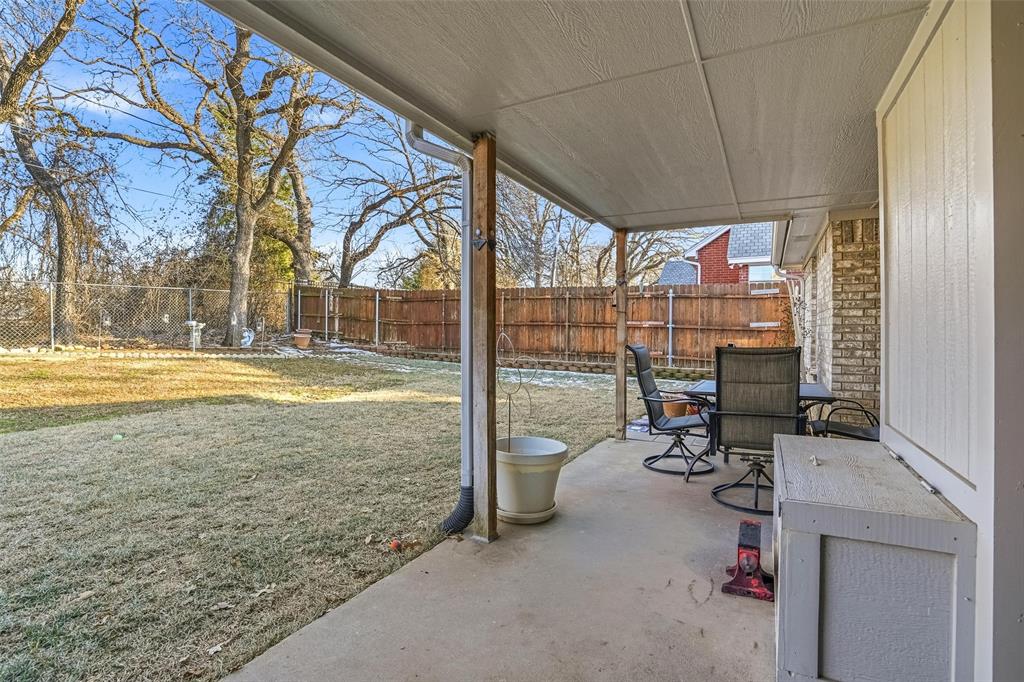 685 Cardinal Ridge Road Burleson, TX 76028 - Photo 33 of 40 a view of a room with gym equipment and floor to ceiling window