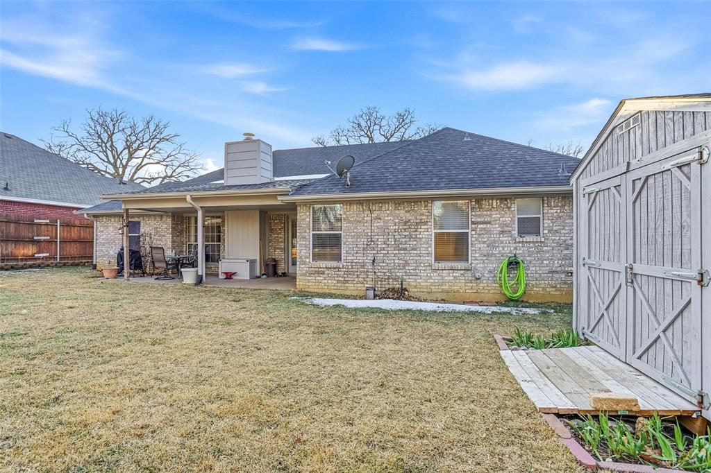 685 Cardinal Ridge Road Burleson, TX 76028 - Photo 36 of 40 a front view of a house with garden