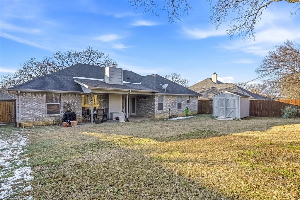 685 Cardinal Ridge Road Burleson, TX 76028 - Photo 37 of 40 a view of a house with a yard and sitting area