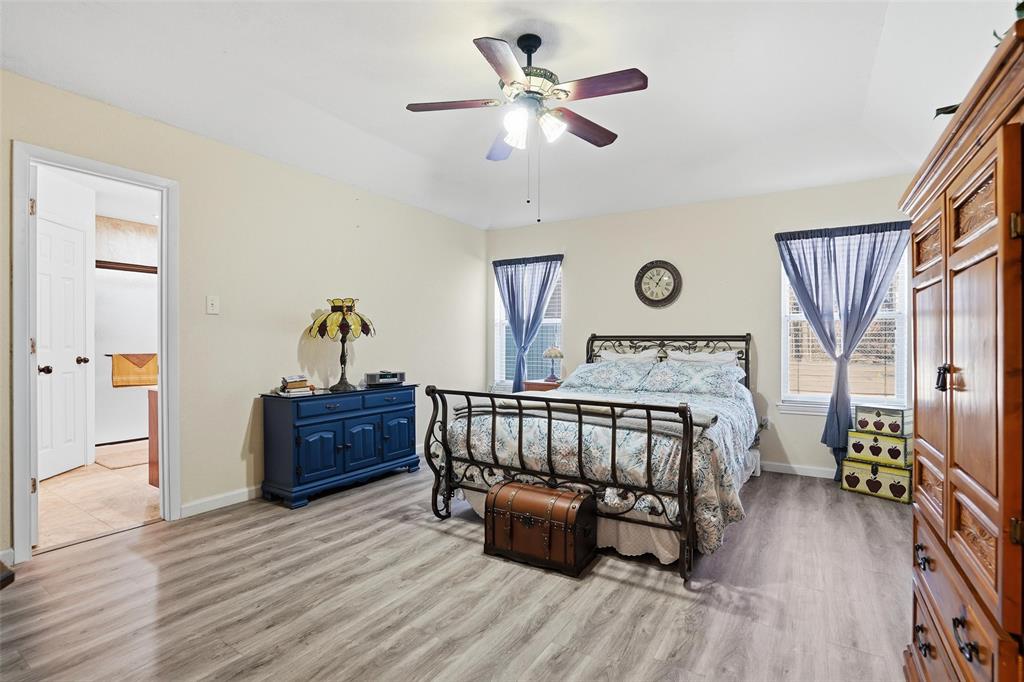 685 Cardinal Ridge Road Burleson, TX 76028 - Photo 5 of 40 a bedroom with furniture window and wooden floor