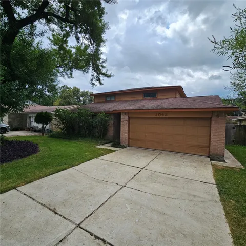 a view of backyard with trampoline