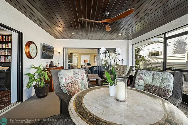 a bathroom with a granite countertop sink a mirror and shower