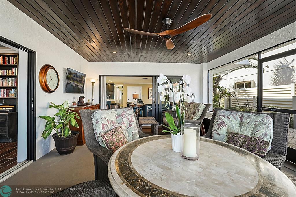 2743 Northeast 28th Court, Unit 3 Lighthouse Point, FL 33064 - Photo 20 of 56 a dining room with furniture and wooden floor
