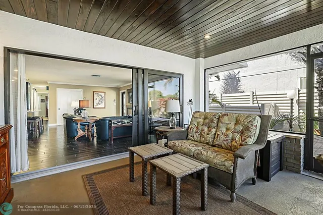 a spacious bedroom with a bed and a ceiling fan