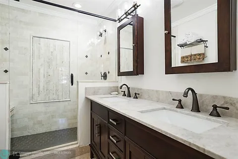 a room with furniture pool table and a window