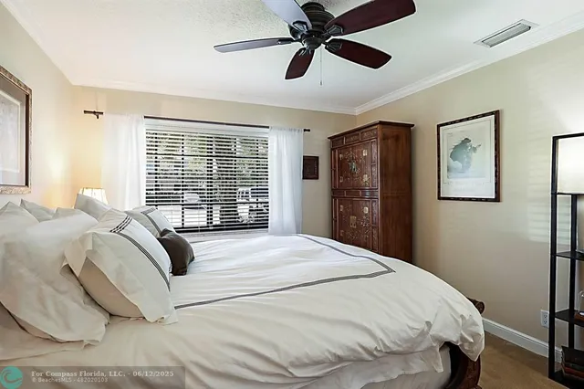a view of a swimming pool with a table and chairs