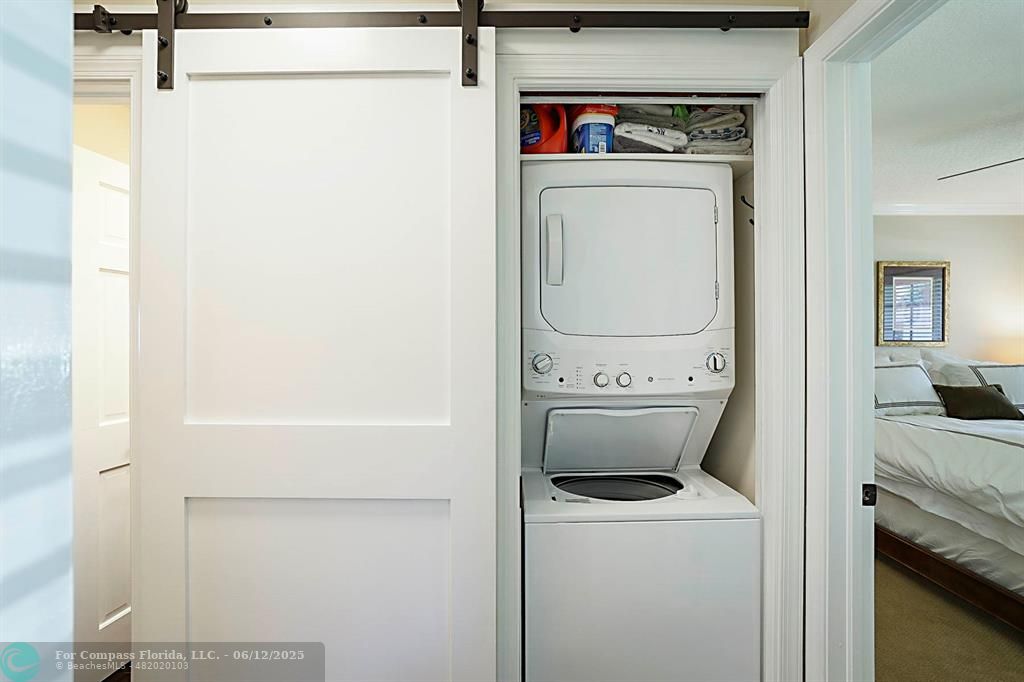 2743 Northeast 28th Court, Unit 3 Lighthouse Point, FL 33064 - Photo 29 of 56 a utility room with dryer and washer