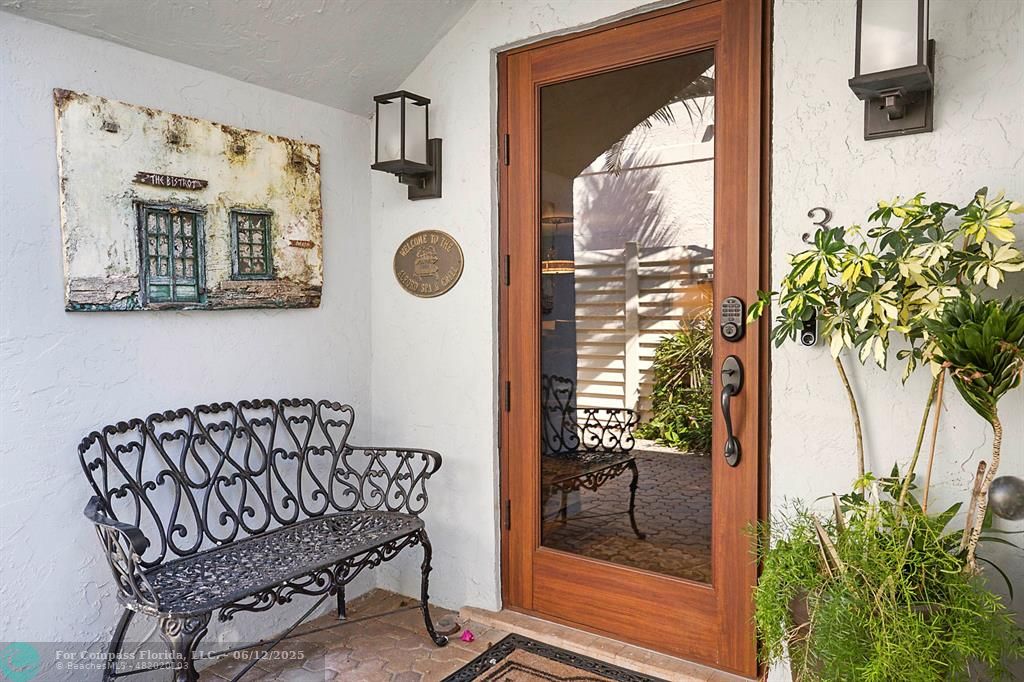 2743 Northeast 28th Court, Unit 3 Lighthouse Point, FL 33064 - Photo 34 of 56 a view of entryway with a potted plant