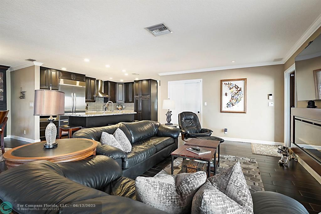 2743 Northeast 28th Court, Unit 3 Lighthouse Point, FL 33064 - Photo 4 of 56 a living room with furniture and a wooden floor