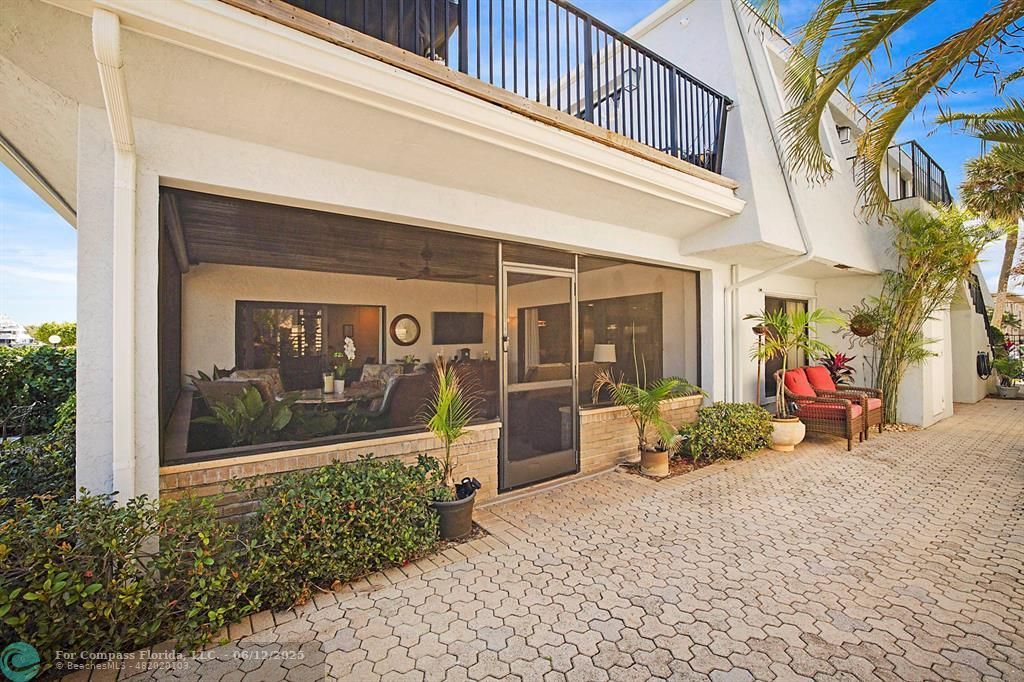 2743 Northeast 28th Court, Unit 3 Lighthouse Point, FL 33064 - Photo 41 of 56 a view of a house with a large windows