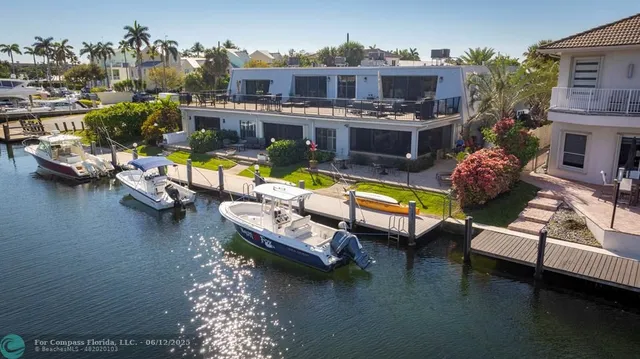 an aerial view of residential houses with city view