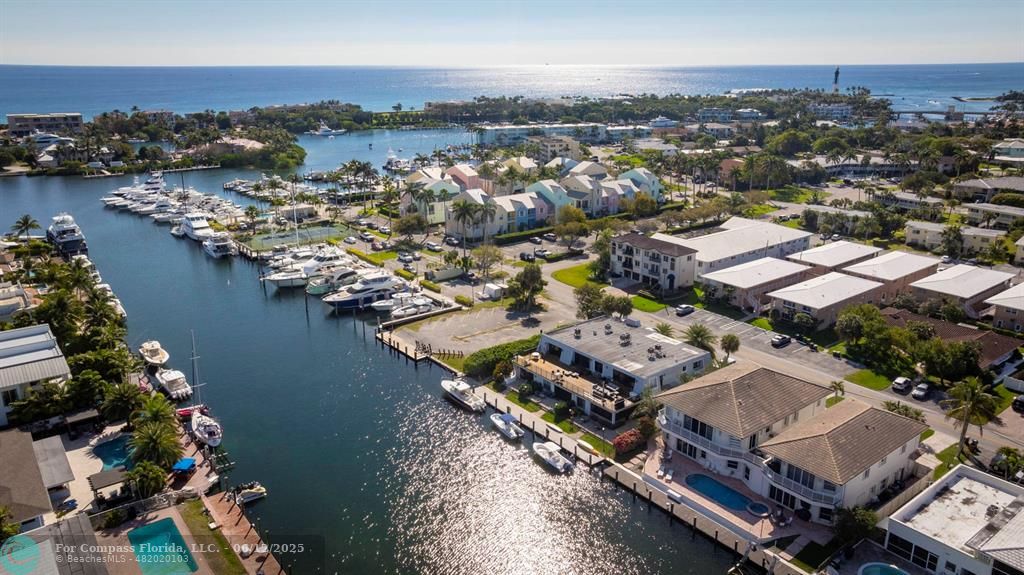 2743 Northeast 28th Court, Unit 3 Lighthouse Point, FL 33064 - Photo 46 of 56 an aerial view of residential houses with outdoor space
