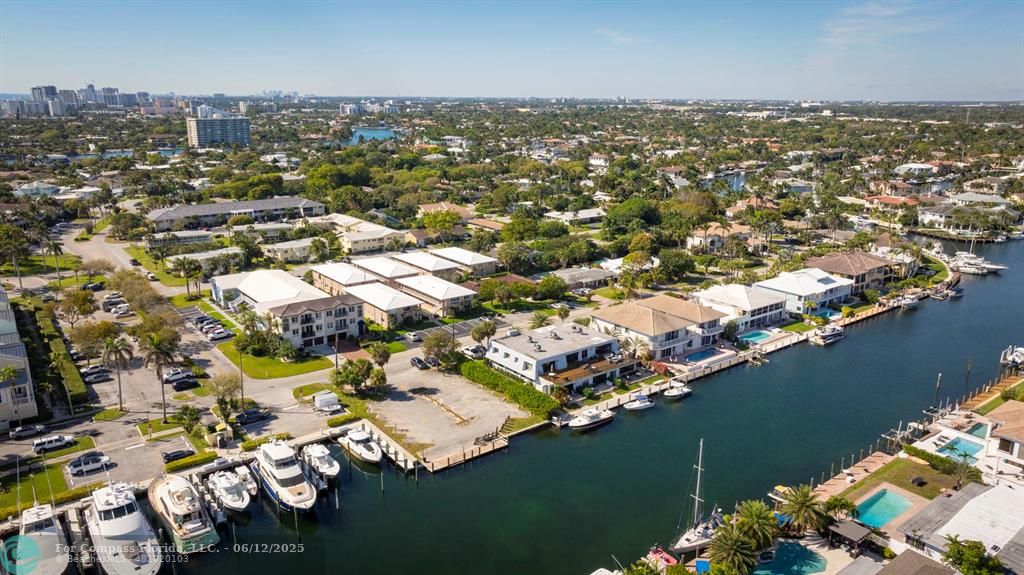 2743 Northeast 28th Court, Unit 3 Lighthouse Point, FL 33064 - Photo 48 of 56 an aerial view of residential houses with outdoor space