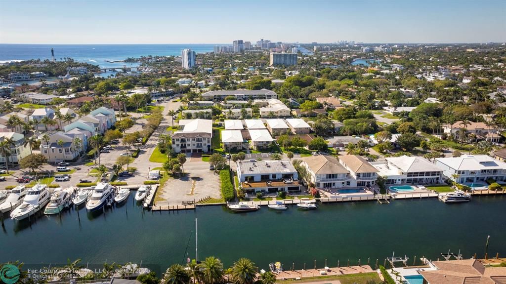 2743 Northeast 28th Court, Unit 3 Lighthouse Point, FL 33064 - Photo 50 of 56 an aerial view of ocean and residential houses with outdoor space
