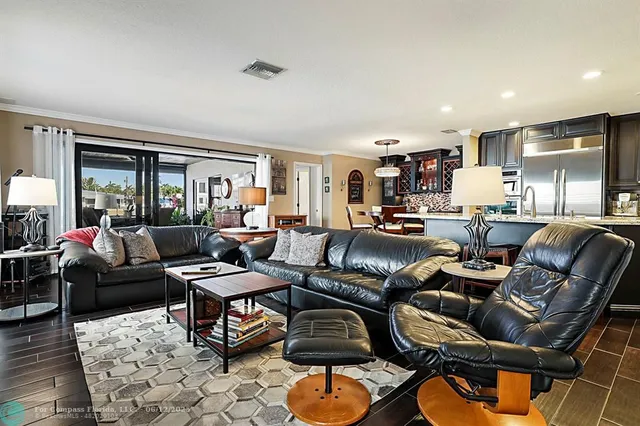 a living room with furniture a rug and a window