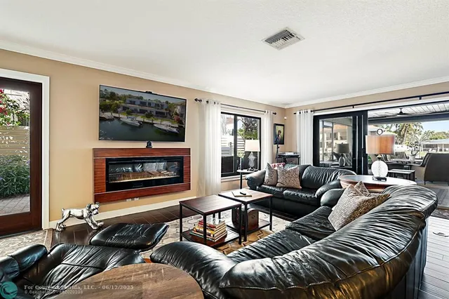 a dining room with furniture and wooden floor