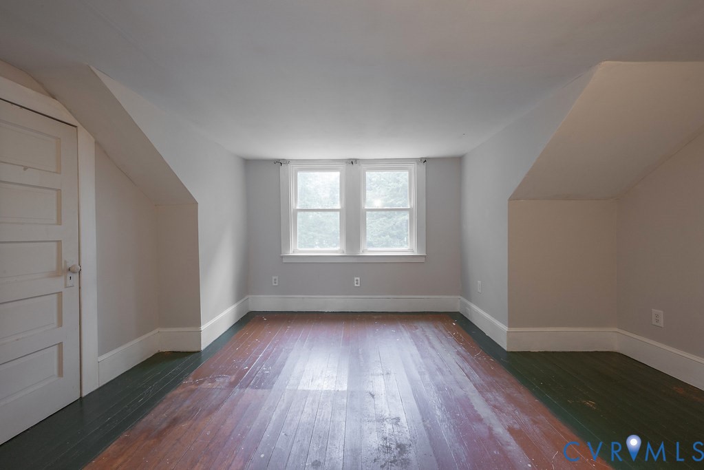 1881 Fairport Road Reedville, VA 22539 - Photo 9 of 54 Hardwood flooring, painted walls, white trim, and
