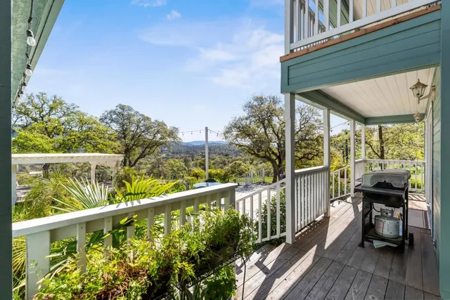 a view of swimming pool with outdoor seating and yard