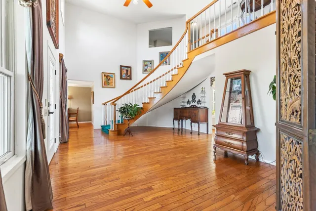 a living room with fish tank and a bookshelf
