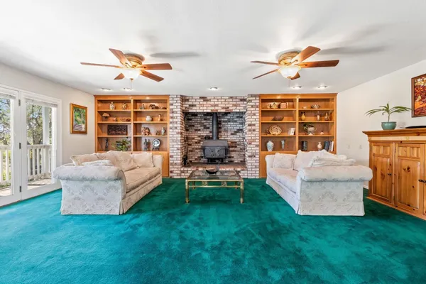 a living room with furniture and a gate
