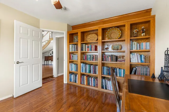 a kitchen with a stove window and cabinets
