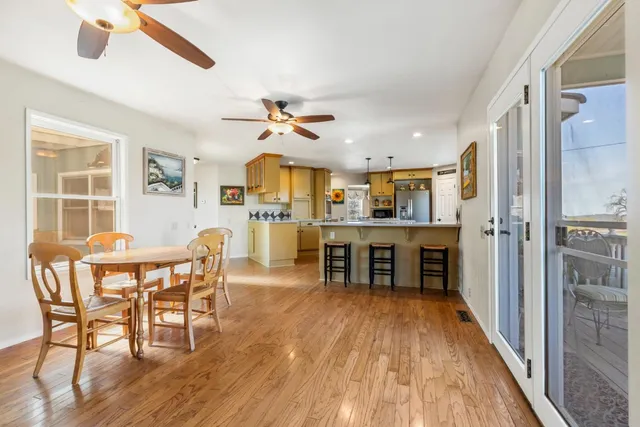 a kitchen with stainless steel appliances granite countertop a sink a stove and refrigerator