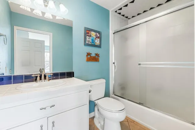 a view of a bedroom with furniture and window