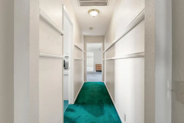 a bathroom with a sink mirror and toilet