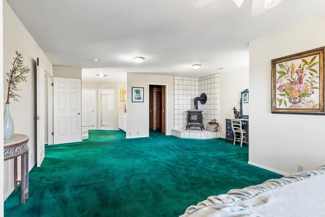a white toilet sitting next to a bathroom sink