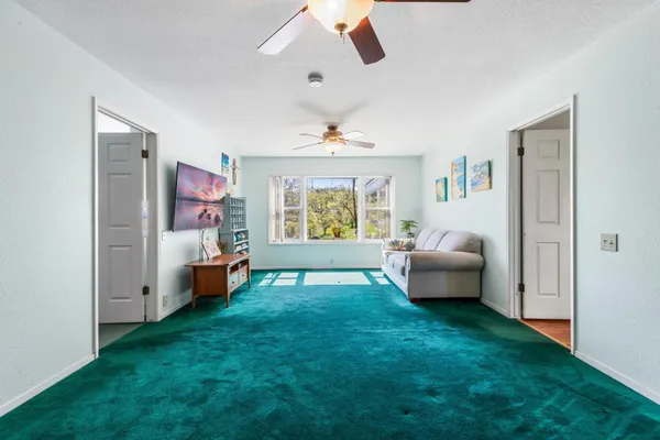 a view of a backyard with sitting area