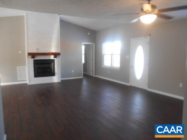 3232 Briery Road Keysville, VA 23947 - Photo 20 of 32 an empty room with wooden floor and windows