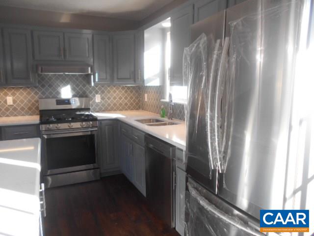 3232 Briery Road Keysville, VA 23947 - Photo 8 of 32 a kitchen with stainless steel appliances granite countertop a refrigerator a sink and a stove