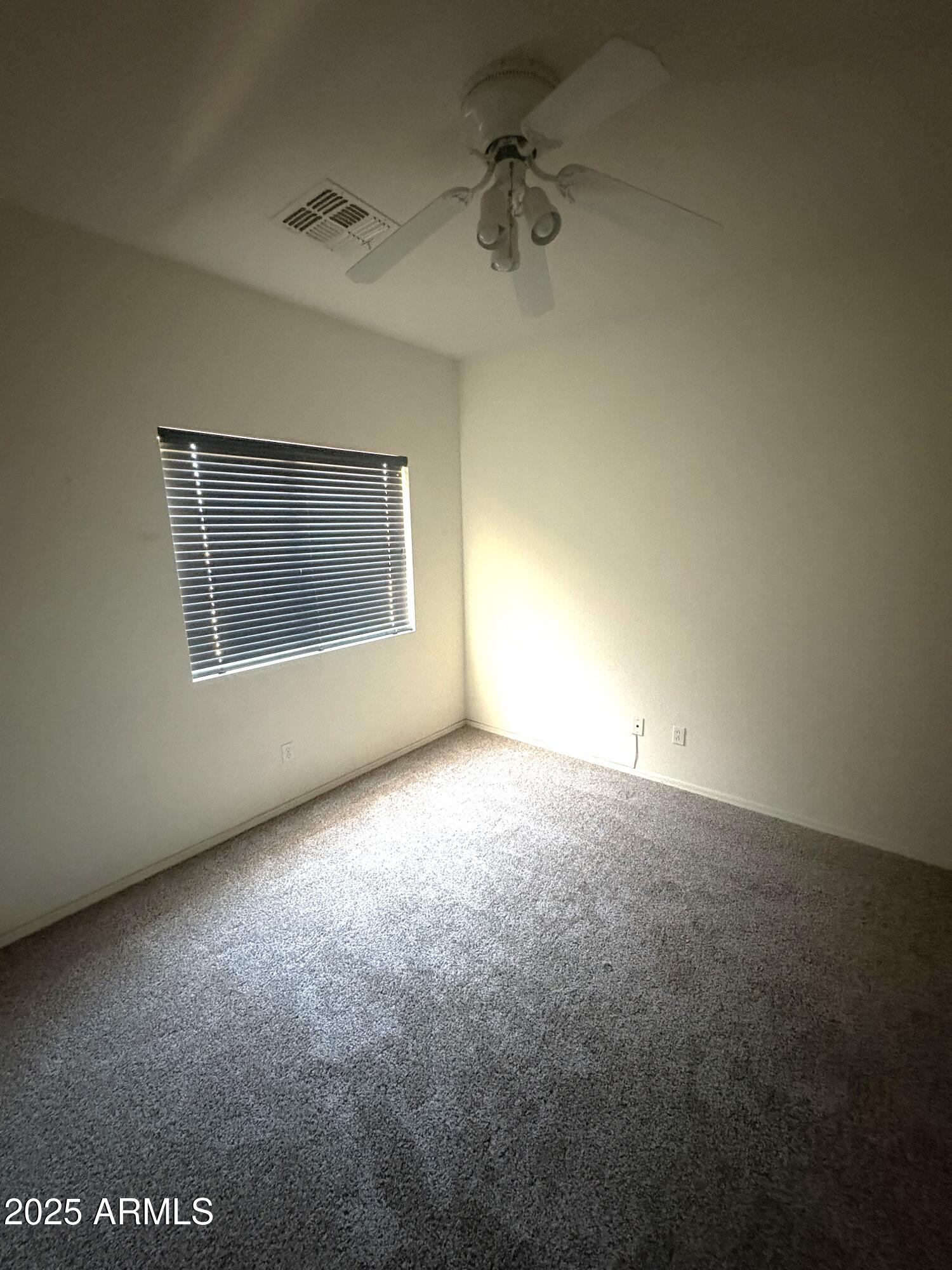3057 East Pinto Valley Road San Tan Valley, AZ 85143 - Photo 12 of 17 a view of an empty room with a window